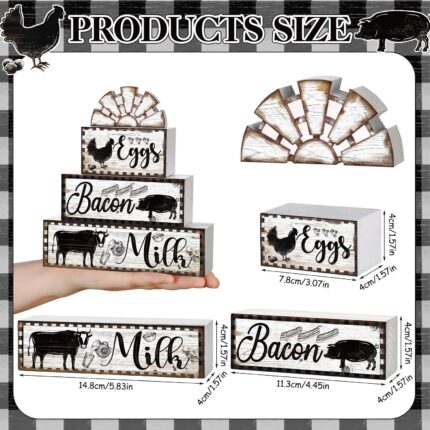 A set of four black and white wooden farmhouse signs, featuring a cow, rooster, and pig, displayed on a tiered tray.