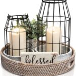 Two KIBAGA rustic farmhouse lanterns, one large and one small, with distressed black and white finishes, on a tabletop.
