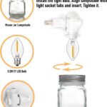 Two clear glass Mason jar night lights with brushed plastic bases, plugged into wall outlets, emitting a warm glow.