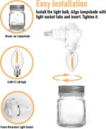 Two clear glass Mason jar night lights with brushed plastic bases, plugged into wall outlets, emitting a warm glow.