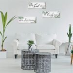 Three Maitys eucalyptus greenery wooden wall signs with 'Bless Family Food Love' text, hung on a rustic wall.