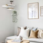 Mkono grey faux eucalyptus plant with long hanging vines in a rectangular galvanized metal pot, displayed on a shelf.