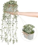 Mkono grey faux eucalyptus plant with long hanging vines in a rectangular galvanized metal pot, displayed on a shelf.